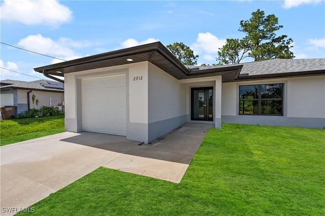 2912 8th St W, Lehigh Acres, FL 33971 - view of front facade featuring stucco siding, concrete driveway, a garage, and a front yard