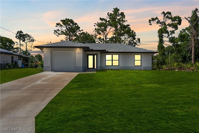 2912 8th St W, Lehigh Acres, FL 33971 - prairie-style home with stucco siding, an attached garage, a front yard, and concrete driveway