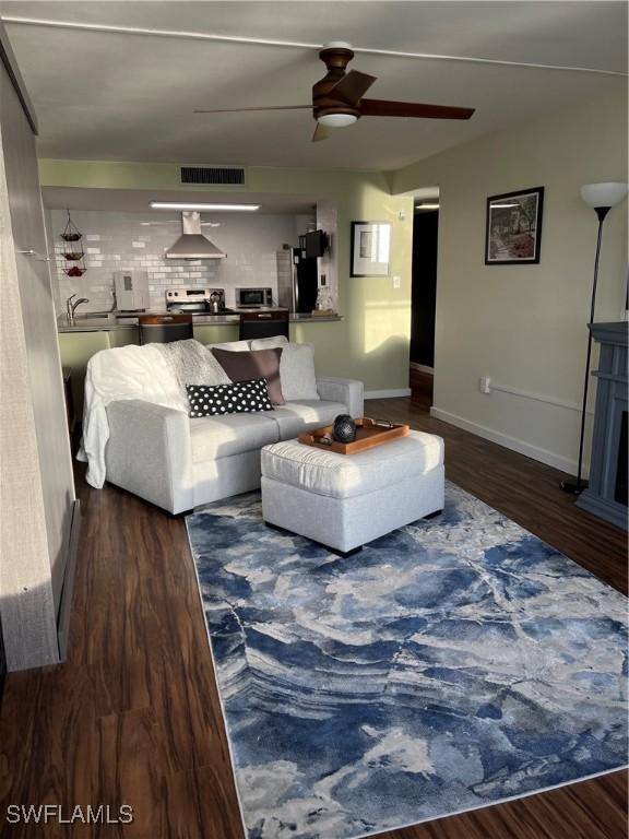 1900 Clifford St Unit 606, Fort Myers, FL 33901 - living room with a ceiling fan and wood finished floors