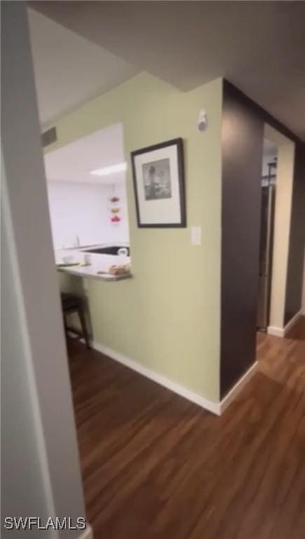 1900 Clifford St Unit 606, Fort Myers, FL 33901 - hallway featuring baseboards and wood finished floors