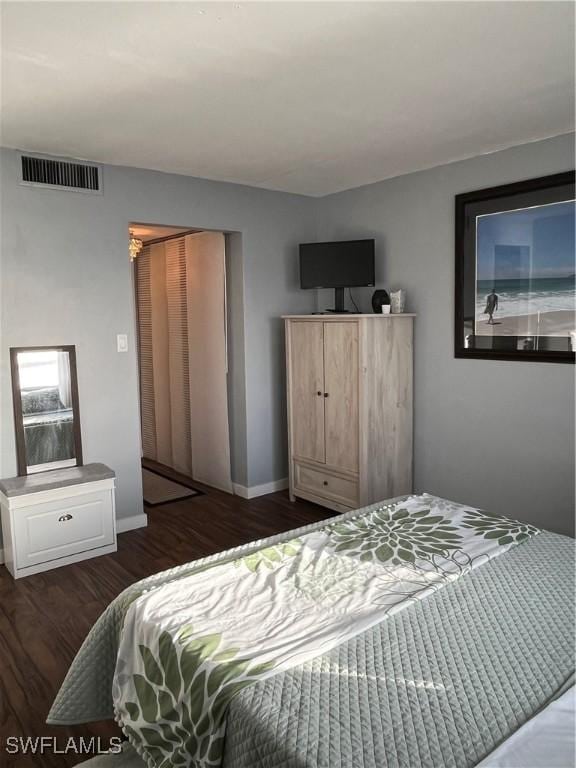 1900 Clifford St Unit 606, Fort Myers, FL 33901 - bedroom with dark wood-style floors and baseboards