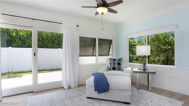 27978 Carl Cir, Bonita Springs, FL 34135 - living area featuring wood finished floors and ceiling fan