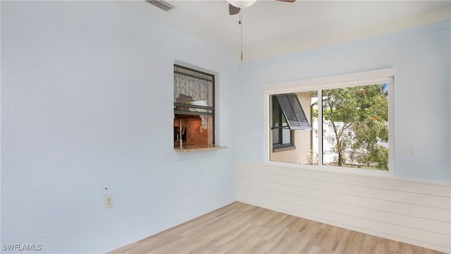 27978 Carl Cir, Bonita Springs, FL 34135 - empty room featuring ceiling fan and wood finished floors