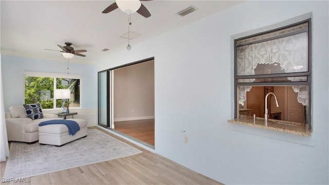 27978 Carl Cir, Bonita Springs, FL 34135 - sitting room featuring ceiling fan and wood finished floors