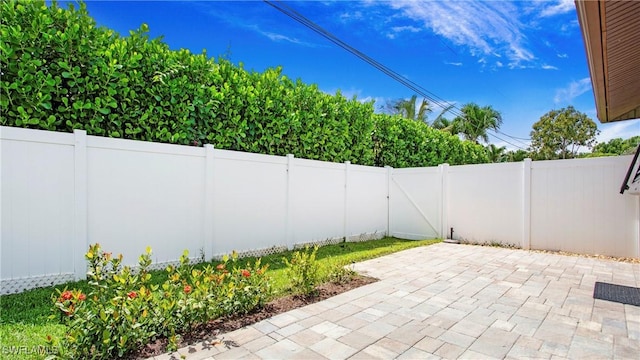 27978 Carl Cir, Bonita Springs, FL 34135 - fenced backyard featuring a patio
