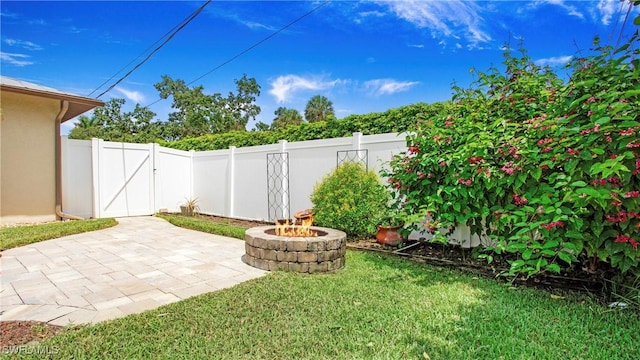 27978 Carl Cir, Bonita Springs, FL 34135 - view of yard featuring a fire pit and a patio
