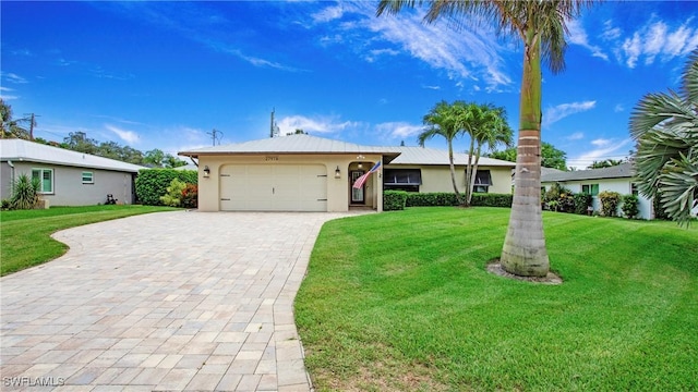 27978 Carl Cir, Bonita Springs, FL 34135 - single story home with a garage, stucco siding, decorative driveway, and a front yard