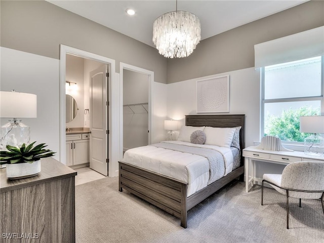 6992 Chapel Creek Ln, North Fort Myers, FL 33917 - bedroom featuring a chandelier, light colored carpet, connected bathroom, a walk in closet, and recessed lighting
