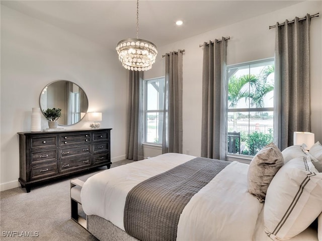 6992 Chapel Creek Ln, North Fort Myers, FL 33917 - bedroom with a chandelier, light carpet, and recessed lighting