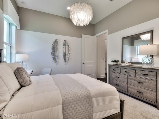 6992 Chapel Creek Ln, North Fort Myers, FL 33917 - bedroom with a chandelier and light colored carpet