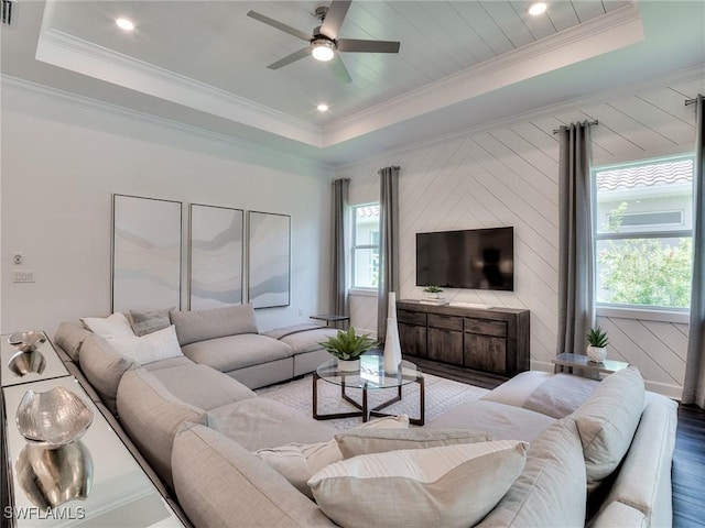 6992 Chapel Creek Ln, North Fort Myers, FL 33917 - living room with a raised ceiling, a ceiling fan, wood finished floors, and ornamental molding