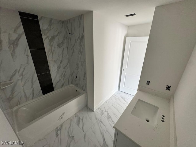 712 Oakridge Ave S, Lehigh Acres, FL 33974 - full bath with marble look tile flooring, vanity, and a combined bath / shower with marble appearance