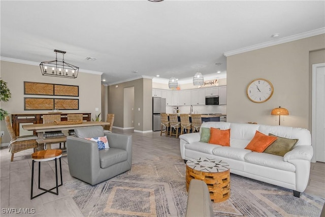 19545 Utopia Ln, Estero, FL 33928 - living room featuring a chandelier, ornamental molding, and recessed lighting