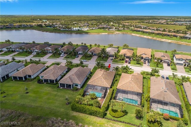 19545 Utopia Ln, Estero, FL 33928 - aerial view of property and surrounding area with nearby suburban area and a large body of water