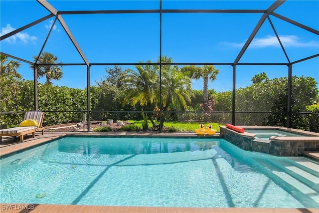 19545 Utopia Ln, Estero, FL 33928 - view of pool featuring a pool with connected hot tub and a lanai