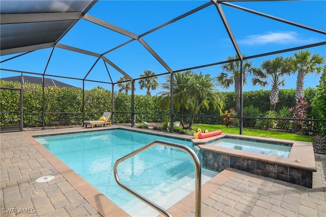 19545 Utopia Ln, Estero, FL 33928 - view of swimming pool with a pool with connected hot tub, a patio, and glass enclosure