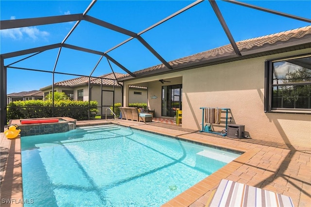 19545 Utopia Ln, Estero, FL 33928 - view of pool with a patio, a ceiling fan, a pool with connected hot tub, and a lanai