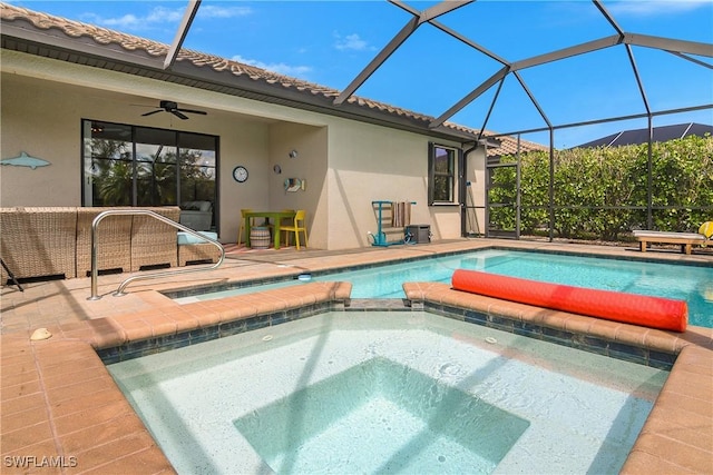 19545 Utopia Ln, Estero, FL 33928 - view of swimming pool featuring a ceiling fan, a patio area, a pool with connected hot tub, and a lanai