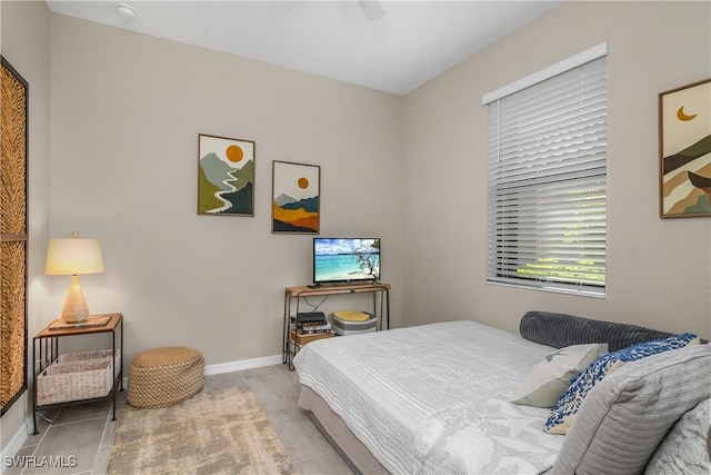 19545 Utopia Ln, Estero, FL 33928 - bedroom featuring light tile patterned floors and a ceiling fan
