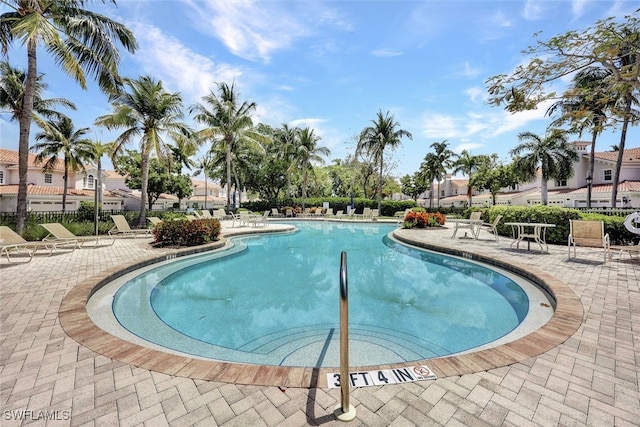 9053 Cascada Way Unit 202, Naples, FL 34114 - community pool with a patio and a residential view