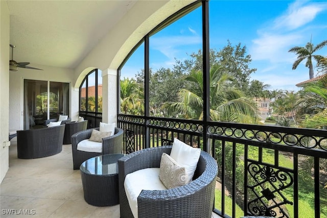 9053 Cascada Way Unit 202, Naples, FL 34114 - balcony featuring a ceiling fan and an outdoor hangout area