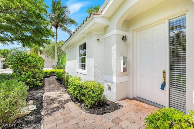 9053 Cascada Way Unit 202, Naples, FL 34114 - view of exterior entry with stucco siding