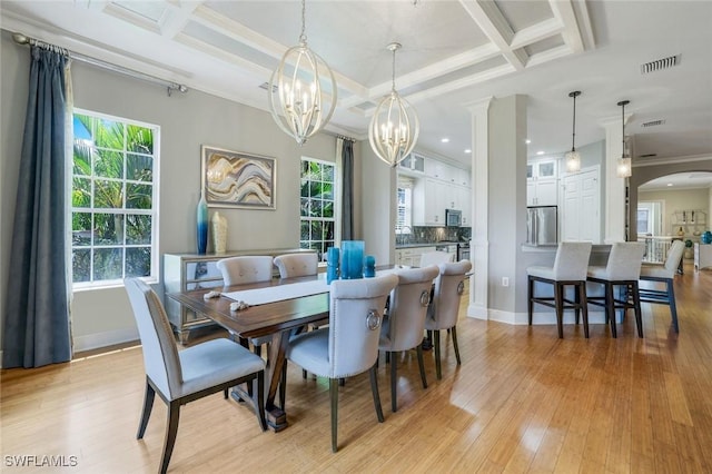9053 Cascada Way Unit 202, Naples, FL 34114 - dining room with coffered ceiling, arched walkways, a chandelier, crown molding, and plenty of natural light
