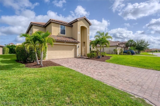 2738 Via Piazza Loop, Fort Myers, FL 33905 - mediterranean / spanish-style house with a tile roof, driveway, a garage, stucco siding, and a front lawn