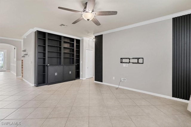 2738 Via Piazza Loop, Fort Myers, FL 33905 - empty room featuring arched walkways, ornamental molding, ceiling fan, light tile patterned floors, and built in shelves