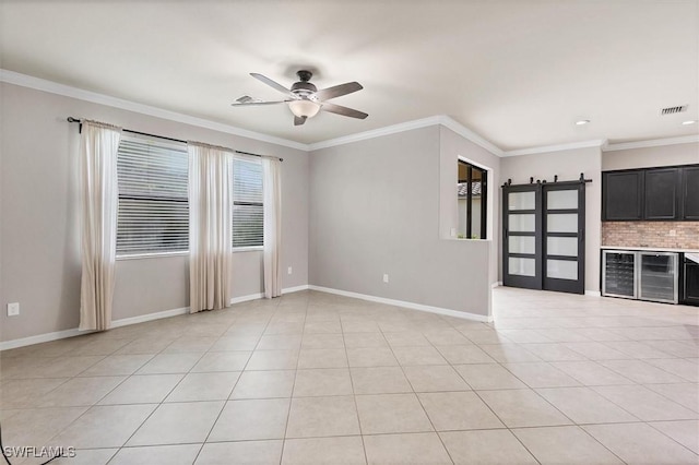 2738 Via Piazza Loop, Fort Myers, FL 33905 - unfurnished room with wine cooler, a ceiling fan, crown molding, and light tile patterned floors