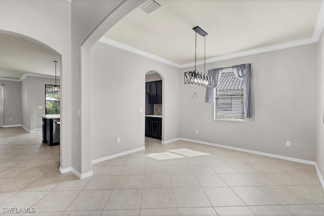2738 Via Piazza Loop, Fort Myers, FL 33905 - unfurnished dining area with crown molding, light tile patterned flooring, and arched walkways