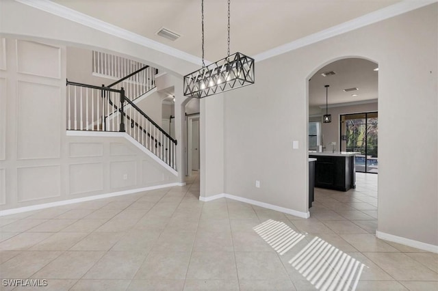 2738 Via Piazza Loop, Fort Myers, FL 33905 - unfurnished dining area with arched walkways, light tile patterned flooring, stairway, and ornamental molding