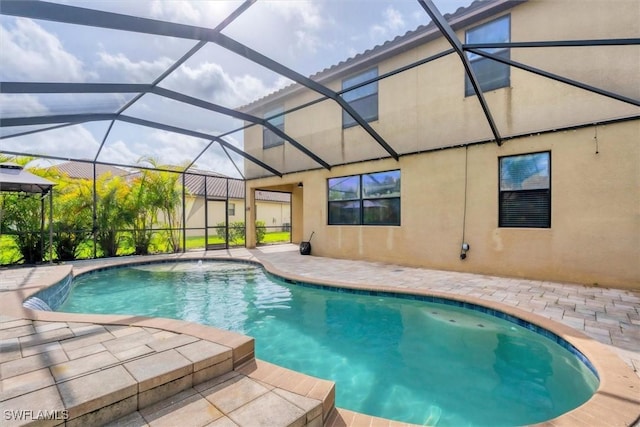 2738 Via Piazza Loop, Fort Myers, FL 33905 - swimming pool featuring a patio area and glass enclosure