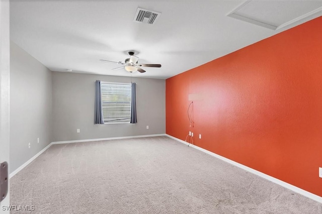 2738 Via Piazza Loop, Fort Myers, FL 33905 - empty room featuring carpet, ceiling fan, and attic access