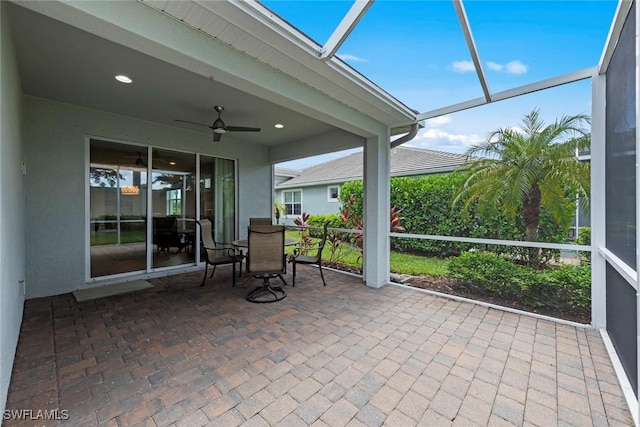 20147 Torch Key Way, Estero, FL 33928 - sunroom featuring a ceiling fan and outdoor dining space