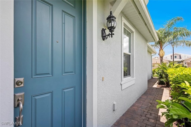 20147 Torch Key Way, Estero, FL 33928 - view of exterior entry with stucco siding