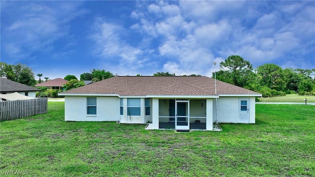 1612 Covington Meadows Cir, Lehigh Acres, FL 33936 - back of house featuring stucco siding and a sunroom