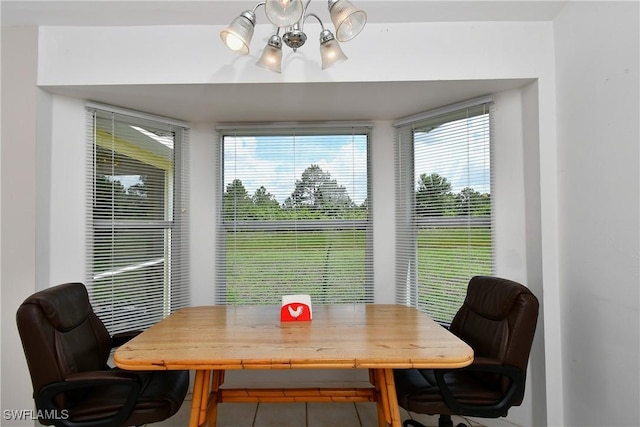1612 Covington Meadows Cir, Lehigh Acres, FL 33936 - tiled dining area featuring a chandelier
