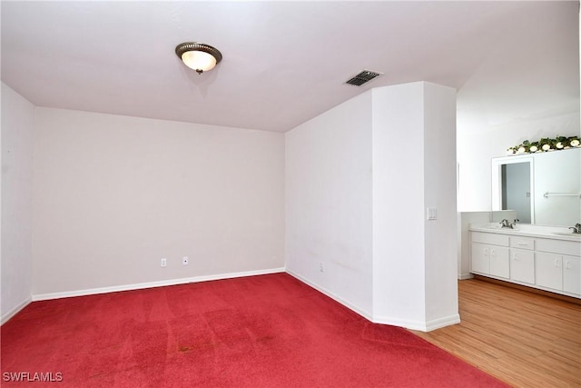 1612 Covington Meadows Cir, Lehigh Acres, FL 33936 - spare room featuring a sink and light colored carpet