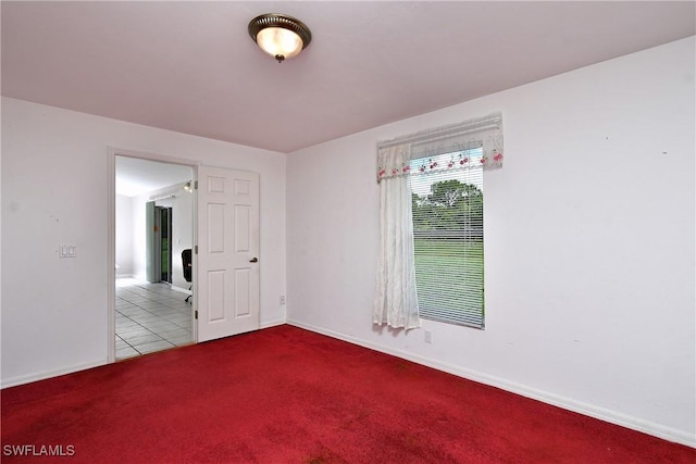 1612 Covington Meadows Cir, Lehigh Acres, FL 33936 - unfurnished room featuring carpet and tile patterned floors