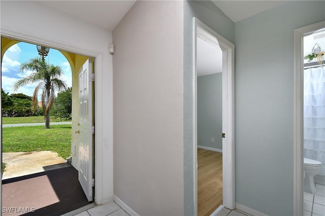 1612 Covington Meadows Cir, Lehigh Acres, FL 33936 - entryway with plenty of natural light and light tile patterned flooring