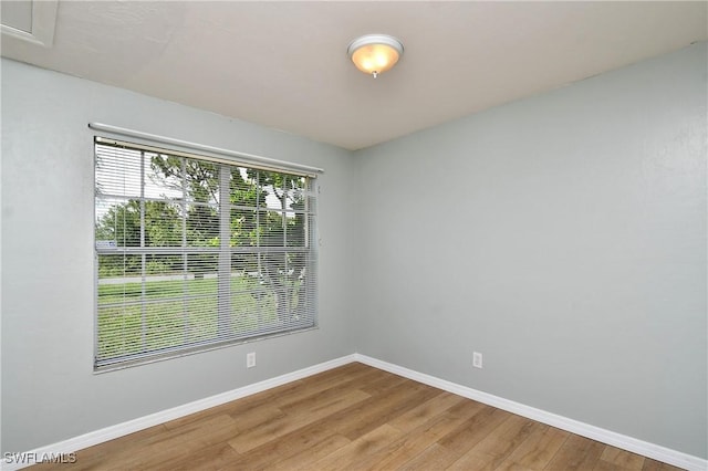 1612 Covington Meadows Cir, Lehigh Acres, FL 33936 - spare room with light wood-type flooring and baseboards