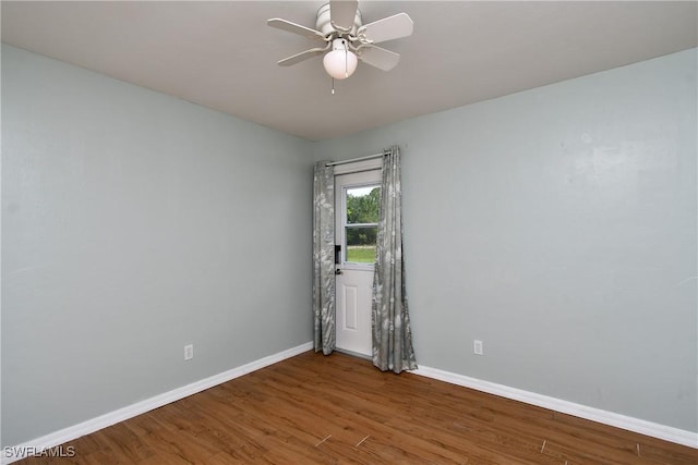 1612 Covington Meadows Cir, Lehigh Acres, FL 33936 - spare room featuring wood finished floors and ceiling fan