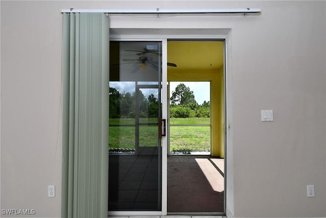1612 Covington Meadows Cir, Lehigh Acres, FL 33936 - doorway to outside with ceiling fan