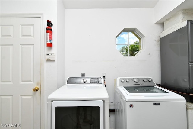 1612 Covington Meadows Cir, Lehigh Acres, FL 33936 - washroom with independent washer and dryer