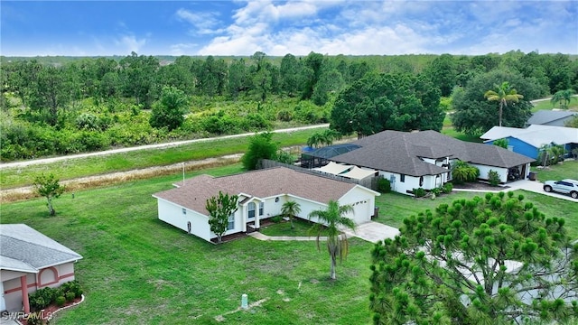1612 Covington Meadows Cir, Lehigh Acres, FL 33936 - view from above of property featuring a heavily wooded area