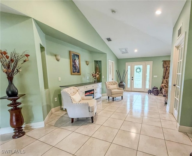 1700 E 15th St, Lehigh Acres, FL 33972 - living room featuring lofted ceiling, light tile patterned floors, french doors, recessed lighting, and a fireplace