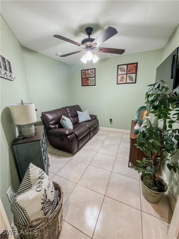 1700 E 15th St, Lehigh Acres, FL 33972 - living room featuring a ceiling fan and light tile patterned floors