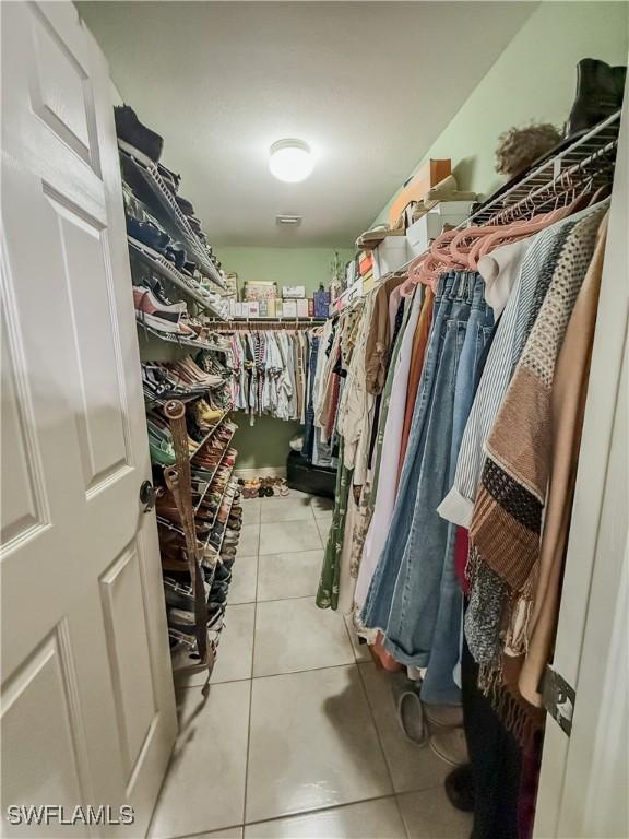 1700 E 15th St, Lehigh Acres, FL 33972 - spacious closet featuring light tile patterned floors