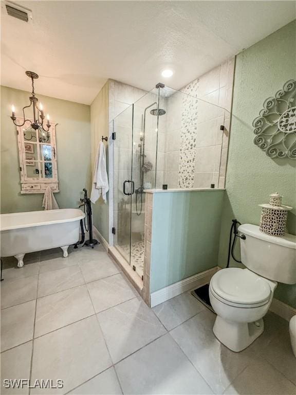 1700 E 15th St, Lehigh Acres, FL 33972 - bathroom featuring a soaking tub, a stall shower, a chandelier, and tile patterned flooring